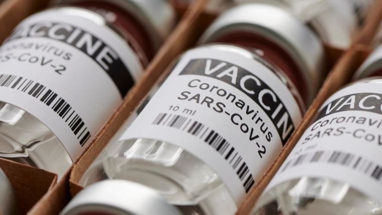 Photo | Dummy vaccine vials in a rack